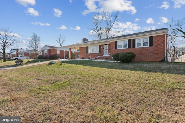 ranch-style home featuring a front yard