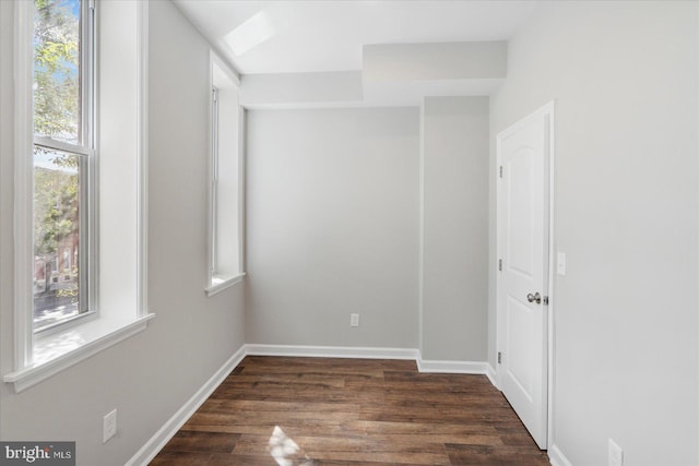 unfurnished room featuring dark hardwood / wood-style flooring