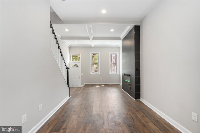 entrance foyer with beam ceiling, dark wood-type flooring, heating unit, and coffered ceiling