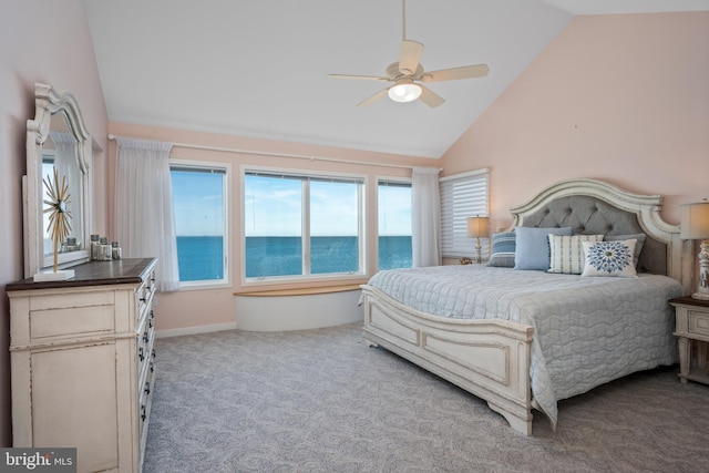 bedroom featuring a water view, ceiling fan, carpet floors, and high vaulted ceiling