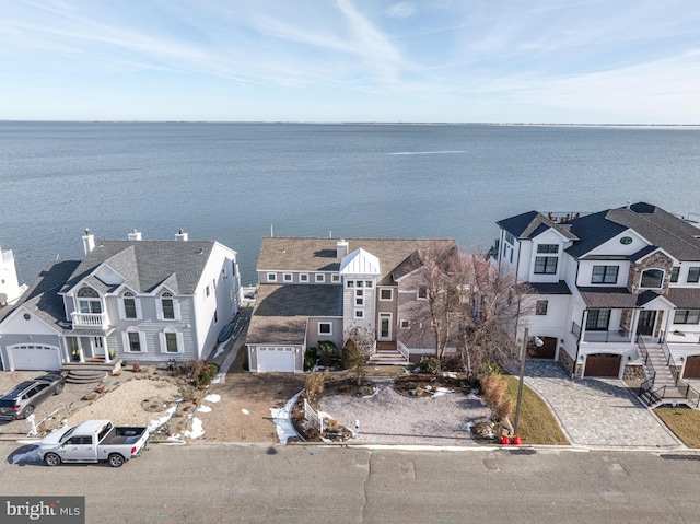 birds eye view of property featuring a water view