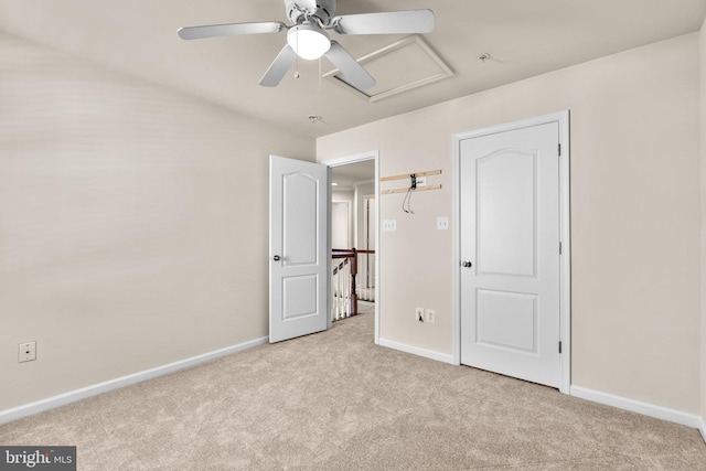 unfurnished bedroom with light colored carpet and ceiling fan