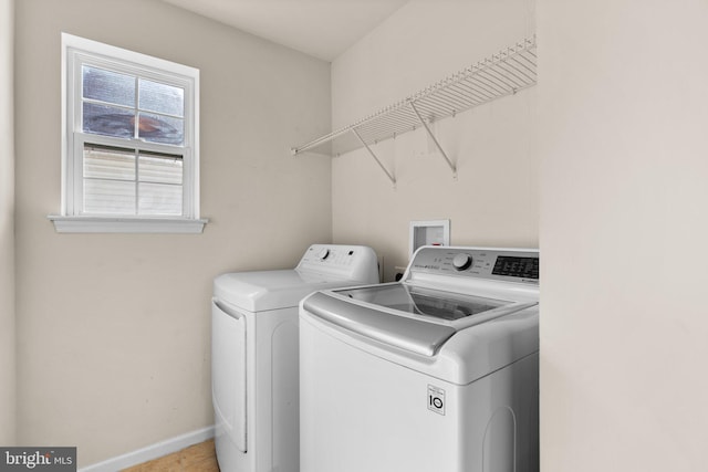 laundry room featuring separate washer and dryer