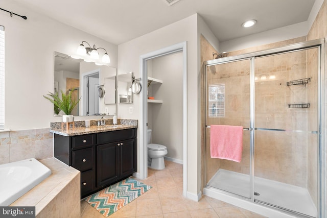 full bathroom with tile patterned flooring, vanity, toilet, and separate shower and tub