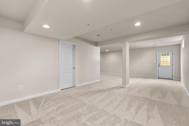 basement with light colored carpet