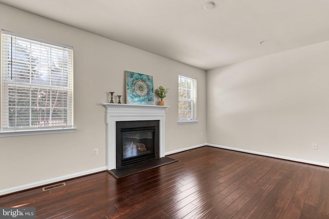 unfurnished living room with hardwood / wood-style floors