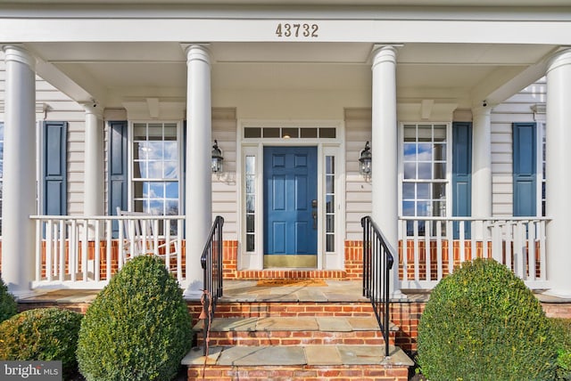 property entrance featuring covered porch