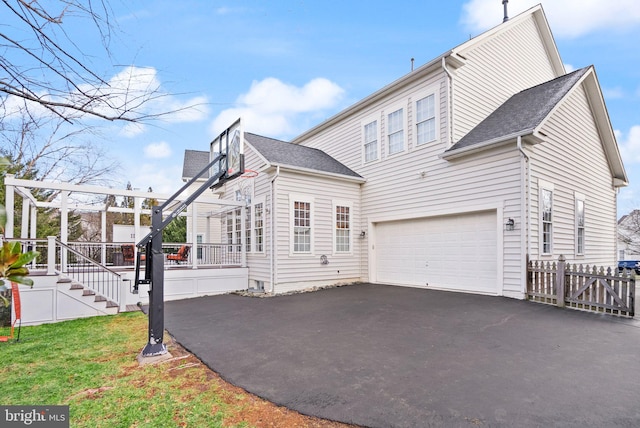 view of property exterior featuring a yard and a garage