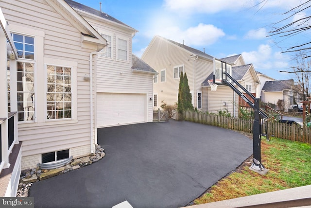 view of property exterior featuring a garage