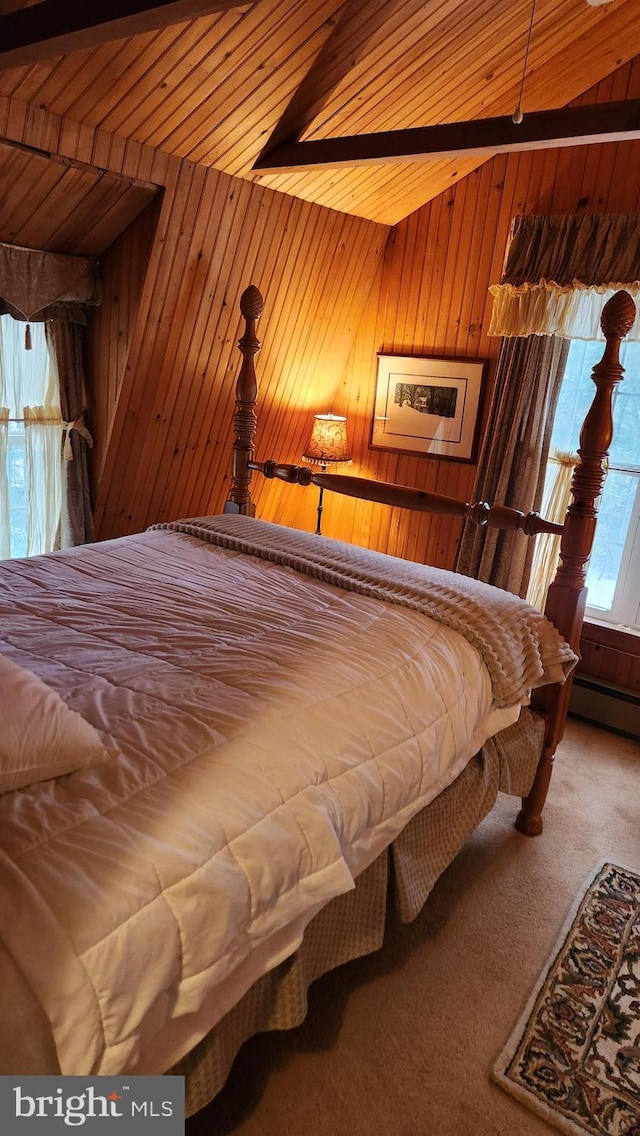 carpeted bedroom with vaulted ceiling, wooden ceiling, and wood walls