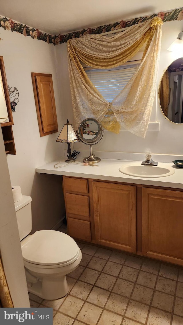 bathroom with vanity and toilet