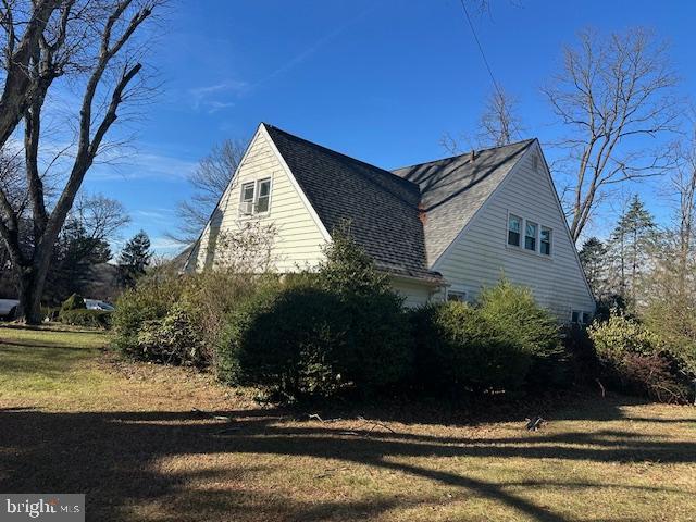 view of home's exterior with a yard