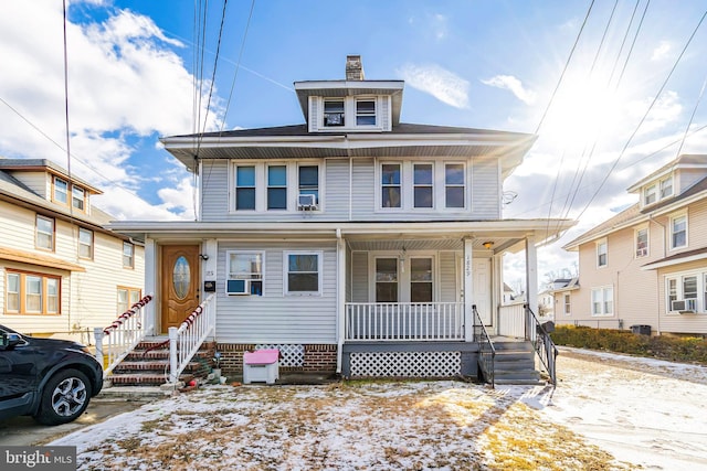 view of front of home featuring a porch, central AC, and cooling unit