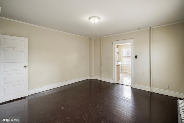 spare room featuring crown molding