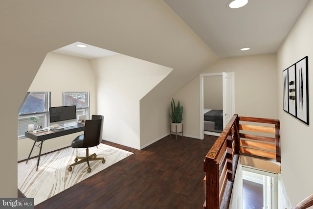 office area with dark wood-type flooring and vaulted ceiling