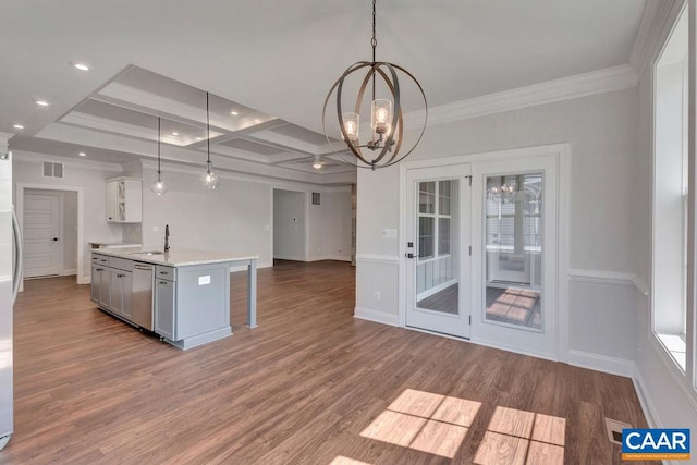 kitchen with a kitchen island with sink, sink, decorative light fixtures, stainless steel dishwasher, and a notable chandelier