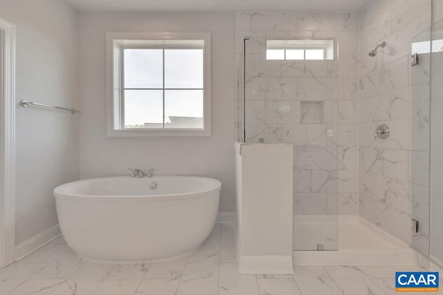 bathroom featuring separate shower and tub