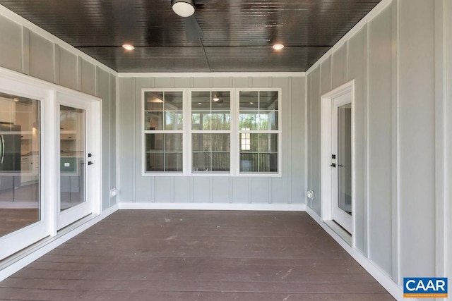 unfurnished sunroom featuring wood ceiling