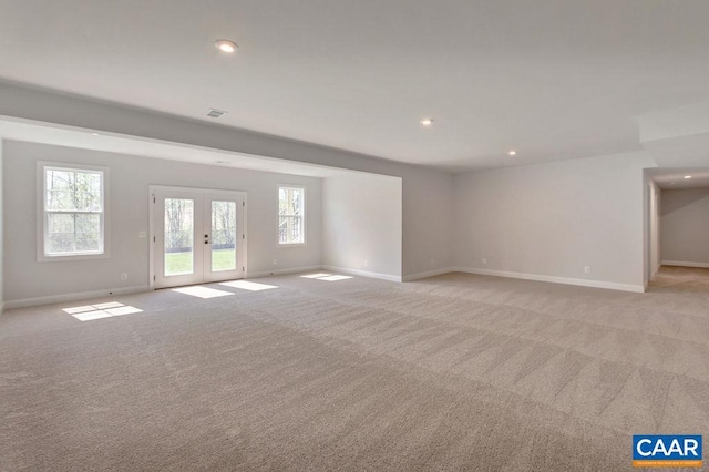 empty room with light carpet and french doors