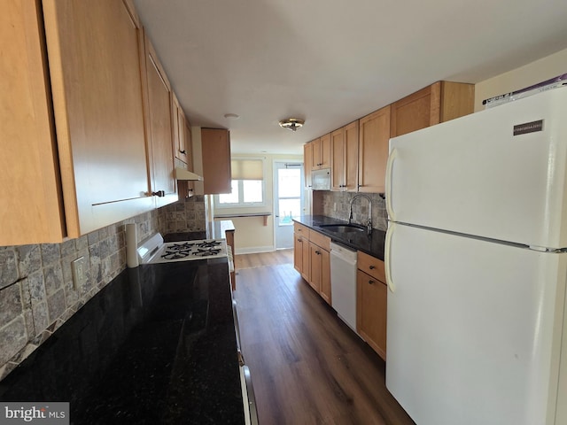 kitchen with white appliances, backsplash, dark wood-type flooring, sink, and light brown cabinetry