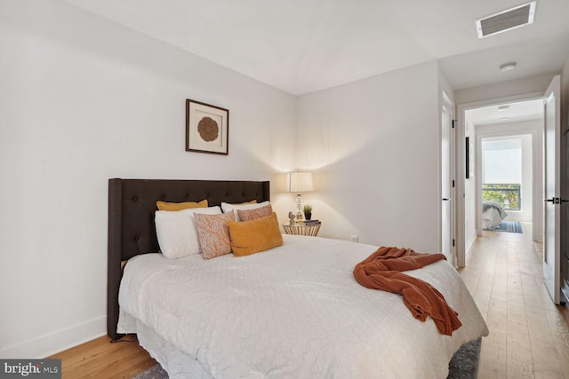 bedroom with light wood-type flooring