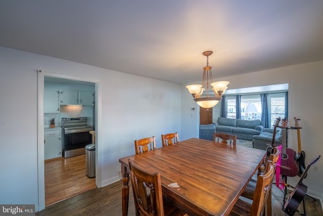 dining area featuring dark hardwood / wood-style flooring