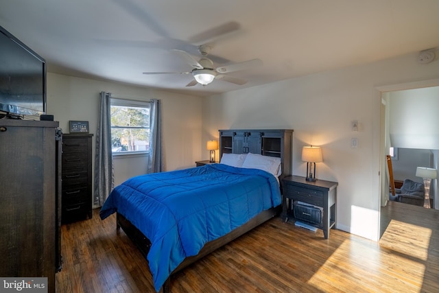 bedroom featuring ceiling fan and dark hardwood / wood-style flooring