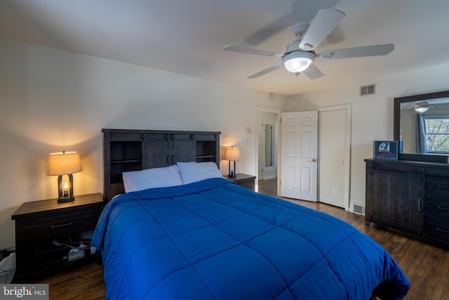 bedroom with ceiling fan and dark hardwood / wood-style floors