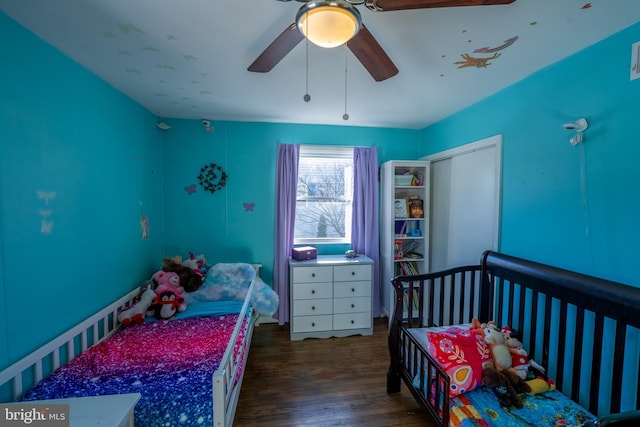 bedroom with ceiling fan and dark hardwood / wood-style flooring