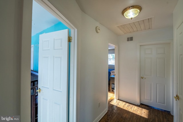 hallway featuring dark hardwood / wood-style floors