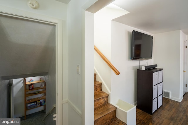 staircase featuring hardwood / wood-style floors