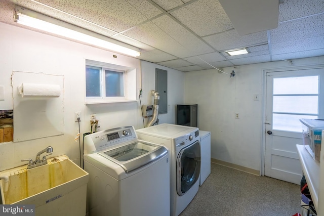 washroom featuring washing machine and dryer and sink