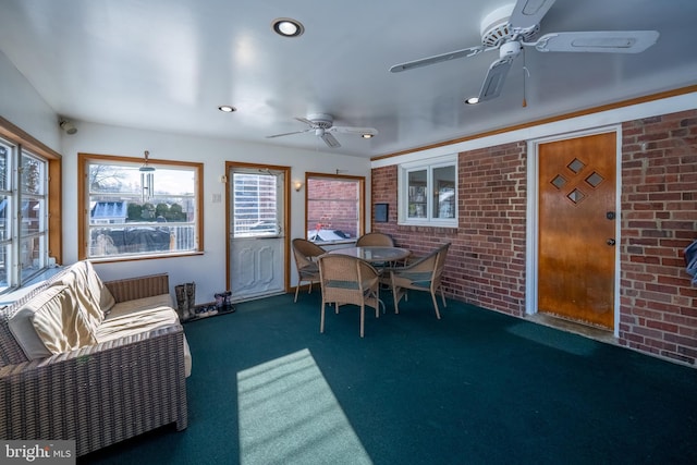 sunroom / solarium with ceiling fan