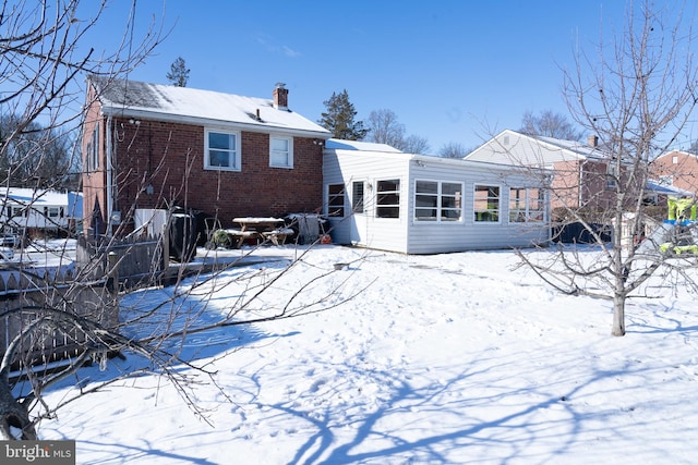 view of snow covered house