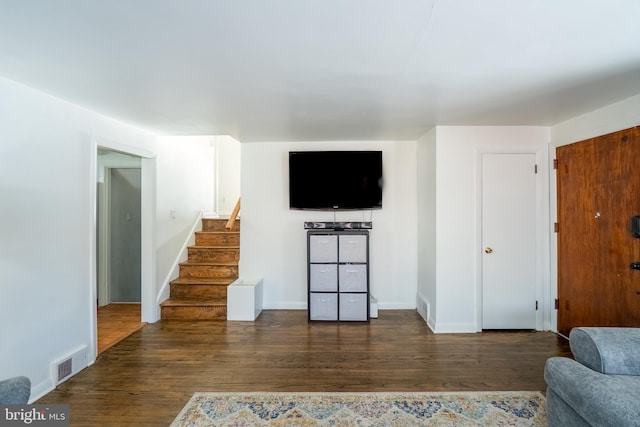 living room with dark hardwood / wood-style flooring