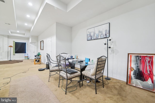 dining area featuring a raised ceiling