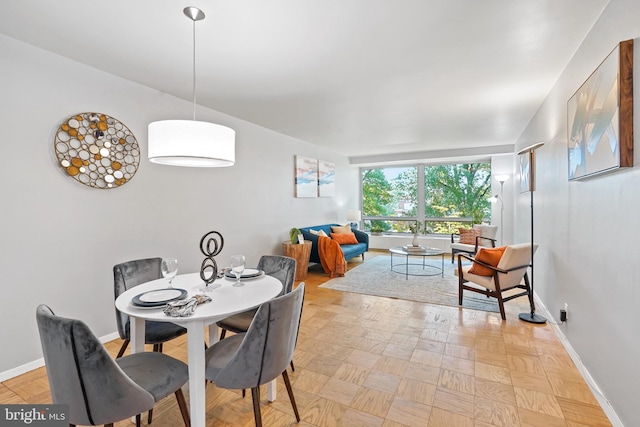 dining room featuring light parquet flooring