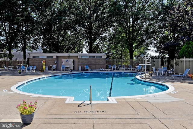 view of swimming pool with a patio area