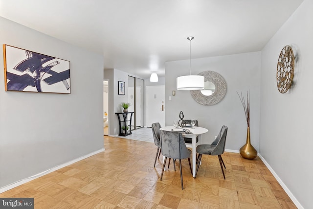 dining room with light parquet flooring