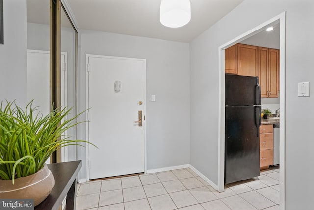 foyer with light tile patterned floors