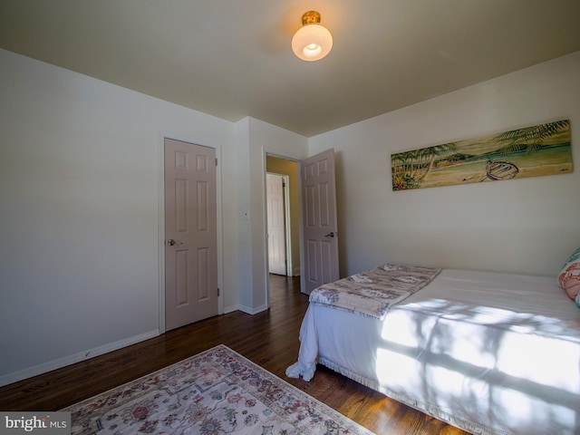 bedroom featuring dark wood-type flooring