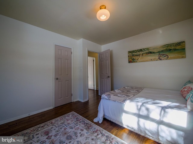 bedroom featuring dark hardwood / wood-style flooring