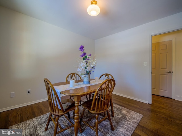 dining area featuring dark hardwood / wood-style flooring