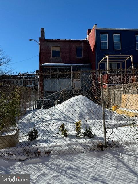 view of snow covered property