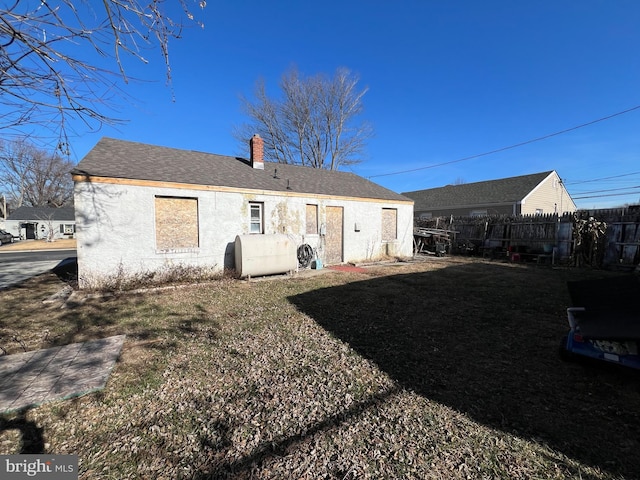 back of house with a yard