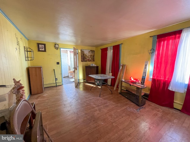 miscellaneous room with hardwood / wood-style flooring and baseboard heating