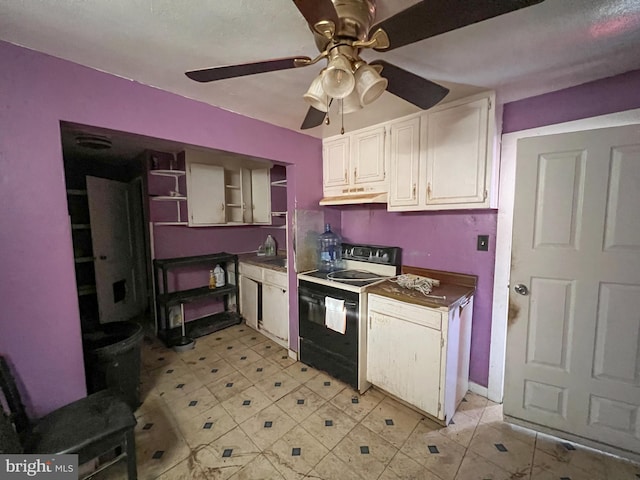 kitchen with white cabinets, ceiling fan, and black / electric stove