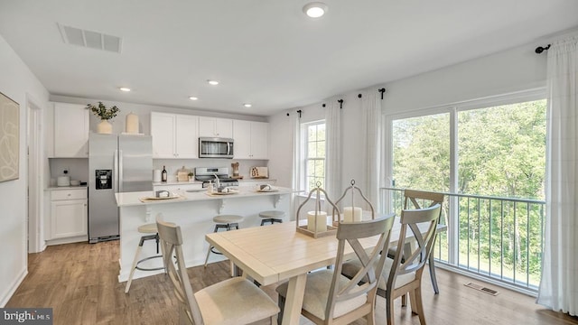 dining space featuring light hardwood / wood-style flooring