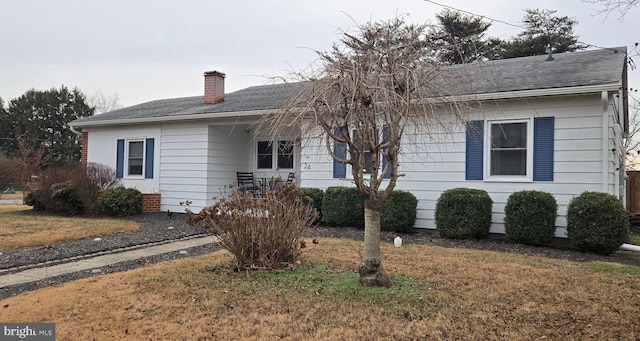 ranch-style house with a front yard