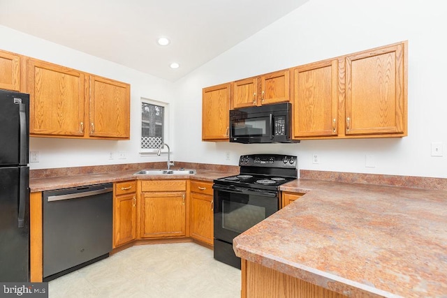 kitchen featuring sink, vaulted ceiling, and black appliances